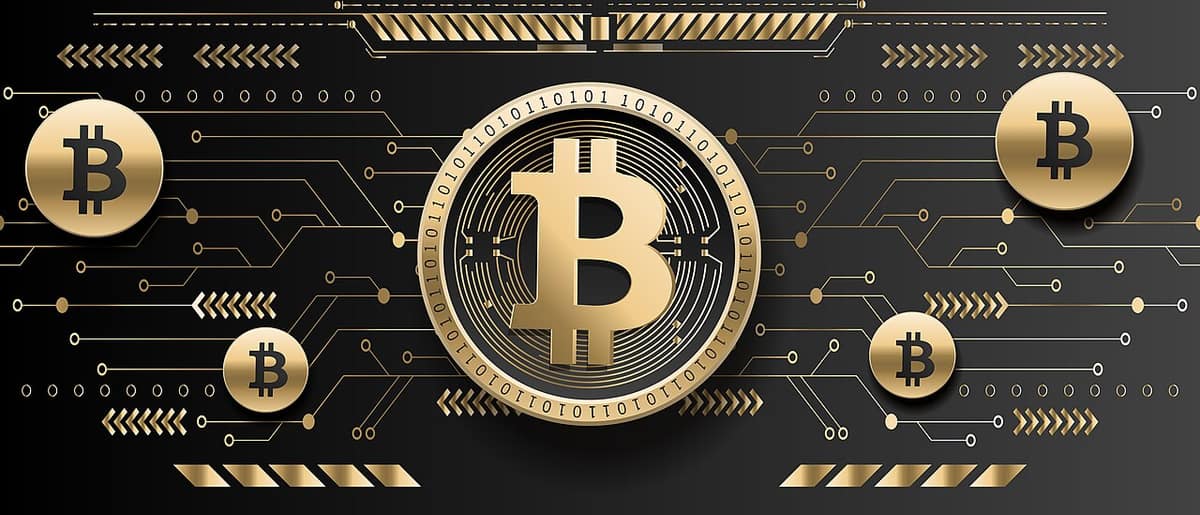 A gold-colored coin bearing the bitcoin symbol